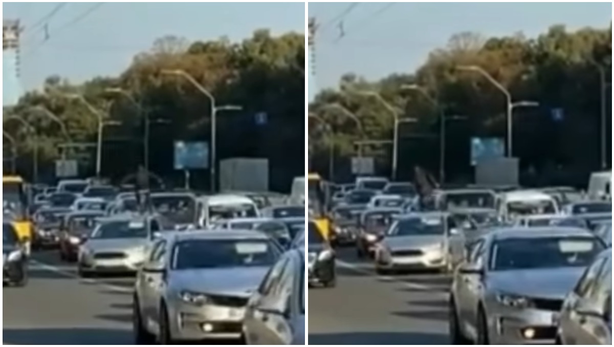 В Киеве мужчина пробежался по автомобилям в пробке (видео)